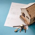 Photo of a house and keys representing the US Housing market